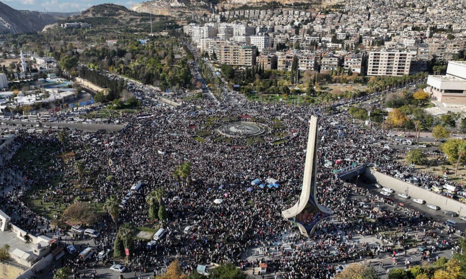 Crowds of Syrians gather during a celebratory demonstration after the first Friday prayer following the overthrow of Bashar al-Assad in the Umayyad Square in Damascus - December 13, 2024 (AP/Ghaith Alsayed)