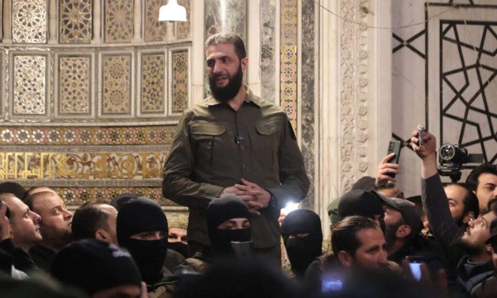 Military Operations Administration leader Ahmed al-Sharaa announces the victory of the Syrian revolution from the Umayyad Mosque in Damascus - December 8, 2024 (AFP)