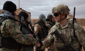 Fighters from the Free Syrian Army meet US soldiers during a patrol near the US military base in al-Tanf, eastern Syria - January 16, 2025 (Operation Inherent Resolve)