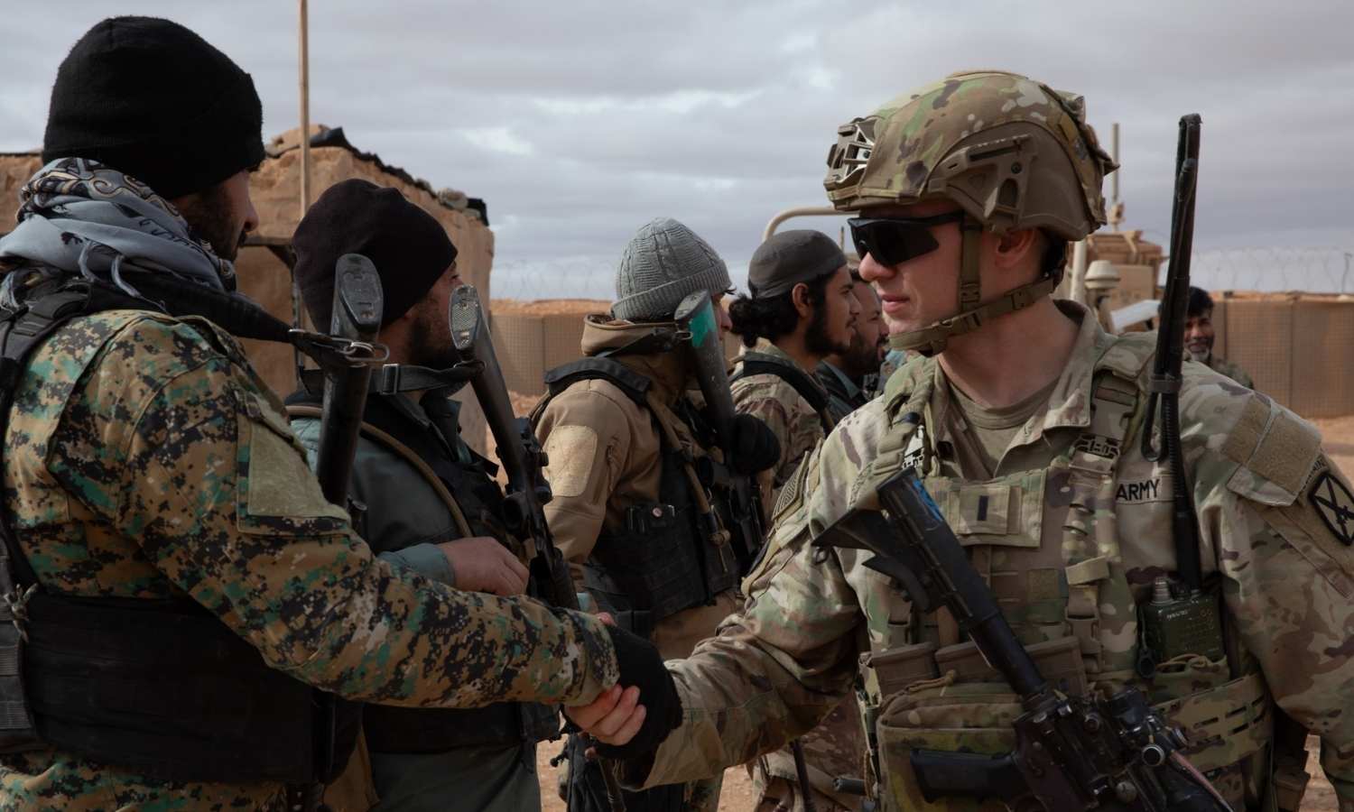 Fighters from the Free Syrian Army meet US soldiers during a patrol near the US military base in al-Tanf, eastern Syria - January 16, 2025 (Operation Inherent Resolve)