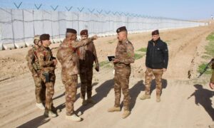 The commander of the Iraqi border forces inspects the construction of the concrete wall with Syria - January 1, 2025 (INA)