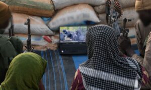 Fighters of the Islamic State group watch a video publication titled "The Life of Jihad" (Islamic State – West Africa Province)