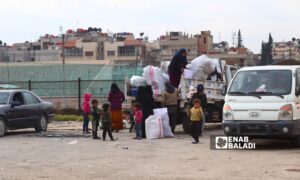 Dozens of families gather at the Martyrs of March 12 stadium in Qamishli city, northeast Syria - December 11, 2024 (Enab Baladi/Ruba Abbas)
