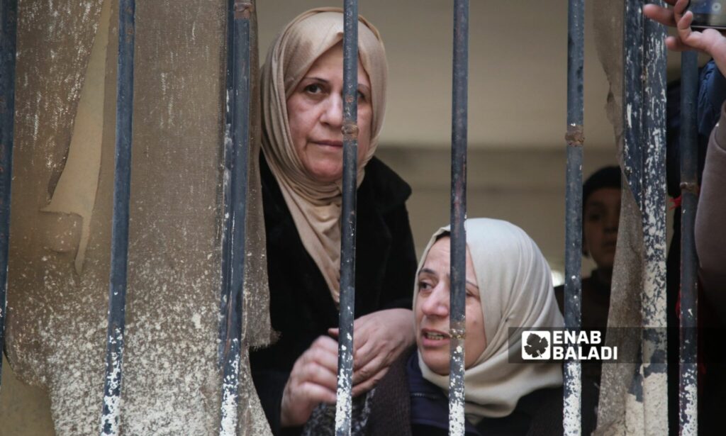 Civilians from the families of detainees wait outside Sednaya prison - December 9, 2024 (Enab Baladi/Dayan Junpaz)