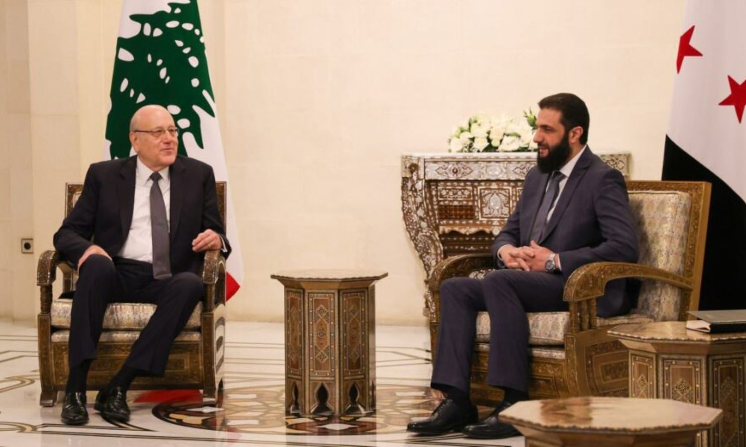 The leader of the new Syrian administration, Ahmed al-Sharaa, meets with the Lebanese Prime Minister at the People's Palace in the Syrian capital, Damascus - January 11, 2025 (SANA)