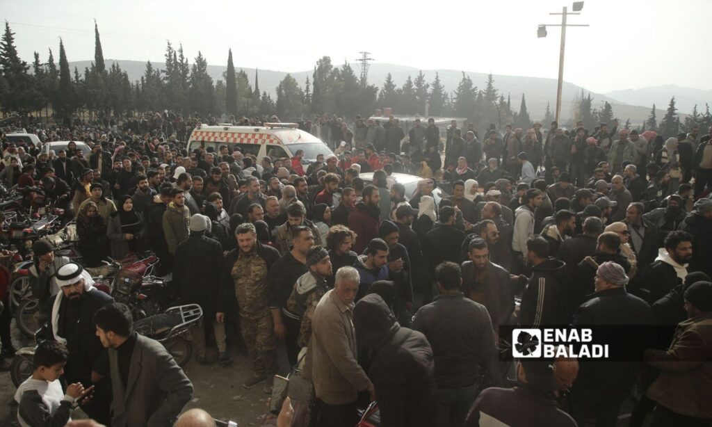 Civilians from the families of detainees wait outside Sednaya prison - December 9, 2024 (Enab Baladi/Dayan Junpaz)