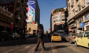 People crossing a street in the capital, Damascus - December 16, 2024 (Reuters)