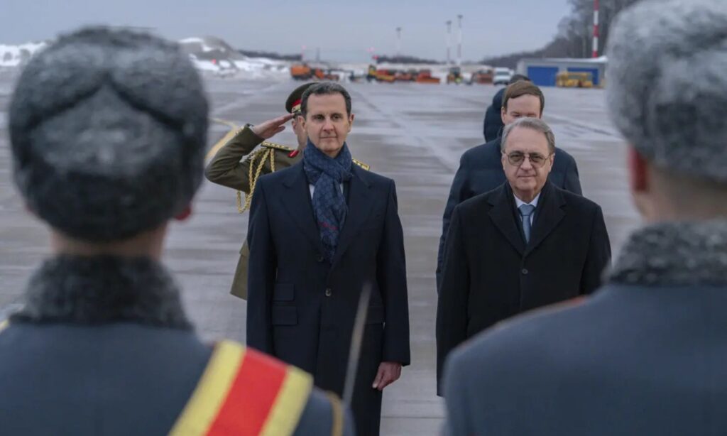 Bashar al-Assad with Russian Deputy Foreign Minister Mikhail Bogdanov during his visit to Russia - March 2023 (AP)