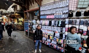 Socks featuring the Assad family are sold on street stalls in Damascus - February 2025 (Enab Baladi)