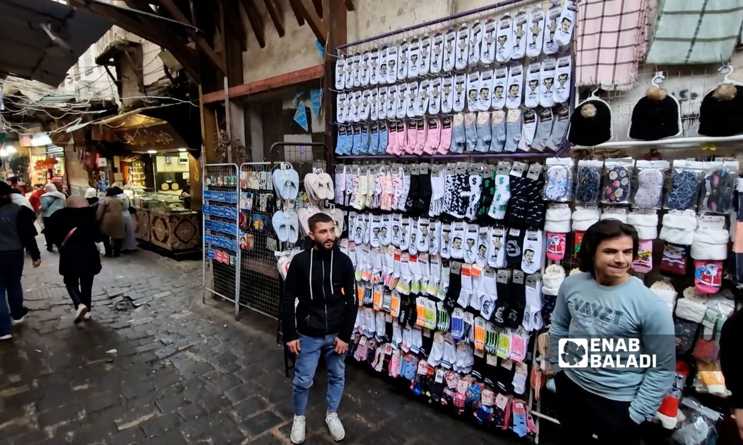 Socks featuring the Assad family are sold on street stalls in Damascus - February 2025 (Enab Baladi)