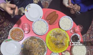 A Syrian family gathers around a Ramadan iftar table in the city of Azaz - March 4 (Enab Baladi/Dayan Junpaz)