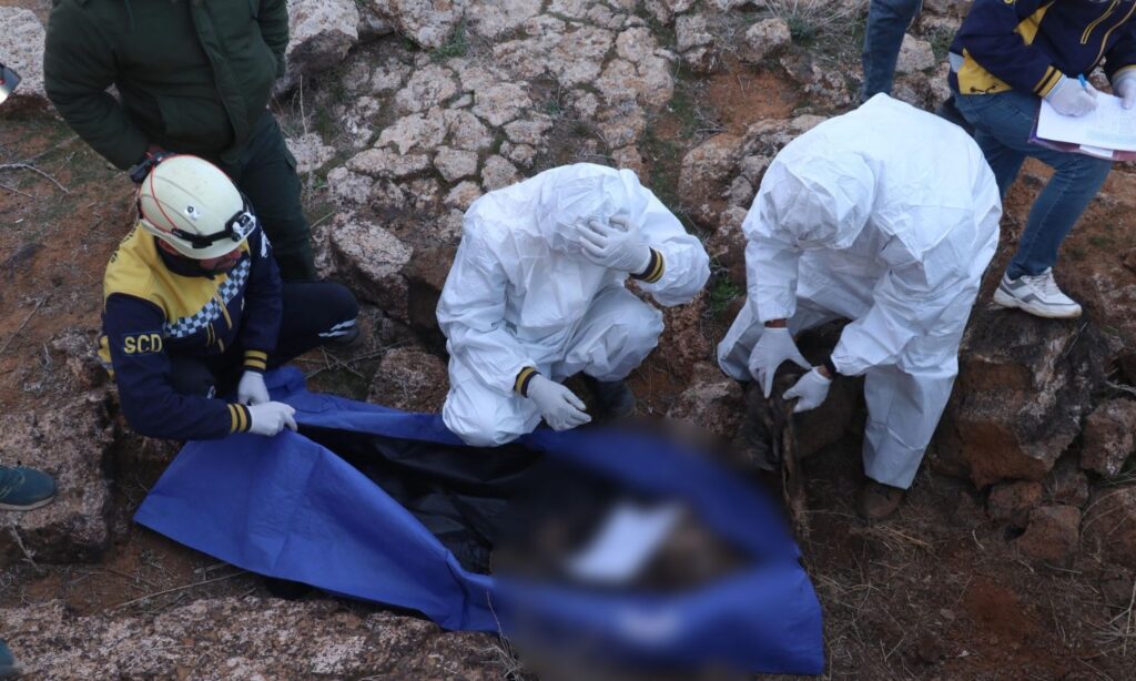 The Syria Civil Defence team retrieve the remains of two unidentified individuals from a military site in the countryside of Daraa - February 25, 2025 (Syria Civil Defence)