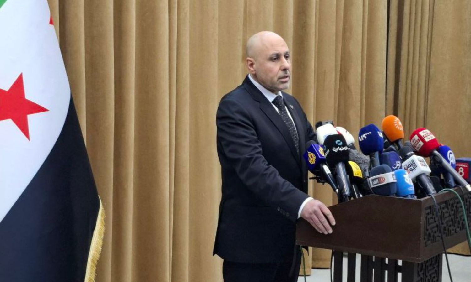 The spokesperson for the investigation committee regarding the coastal events, Yasser al-Farhan, during a press conference in Damascus - March 11, 2025 (SANA)
