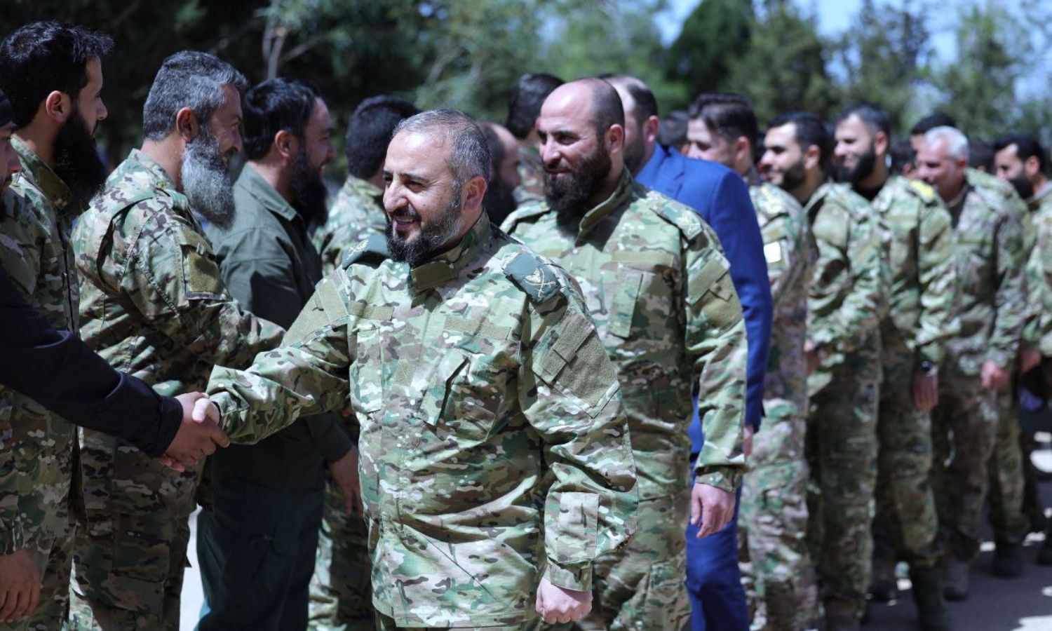 Syrian Defense Minister Murhaf Abu Qasra with leaders and soldiers of one of the military divisions – March 31, 2025 (Ministry of Defense)