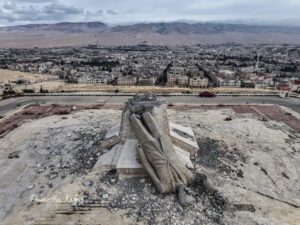 The Fallen Assad Statue in Deir Atiyah, “The Fall of Tyrants: The End of an Era of Oppression and Injustice” (Omar Haj Kadour)