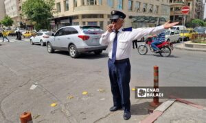 Policeman Mohammed Shahwan during his work in the Victoria Bridge area of Damascus - April 30, 2025 (Enab Baladi/Christina al-Shammas)