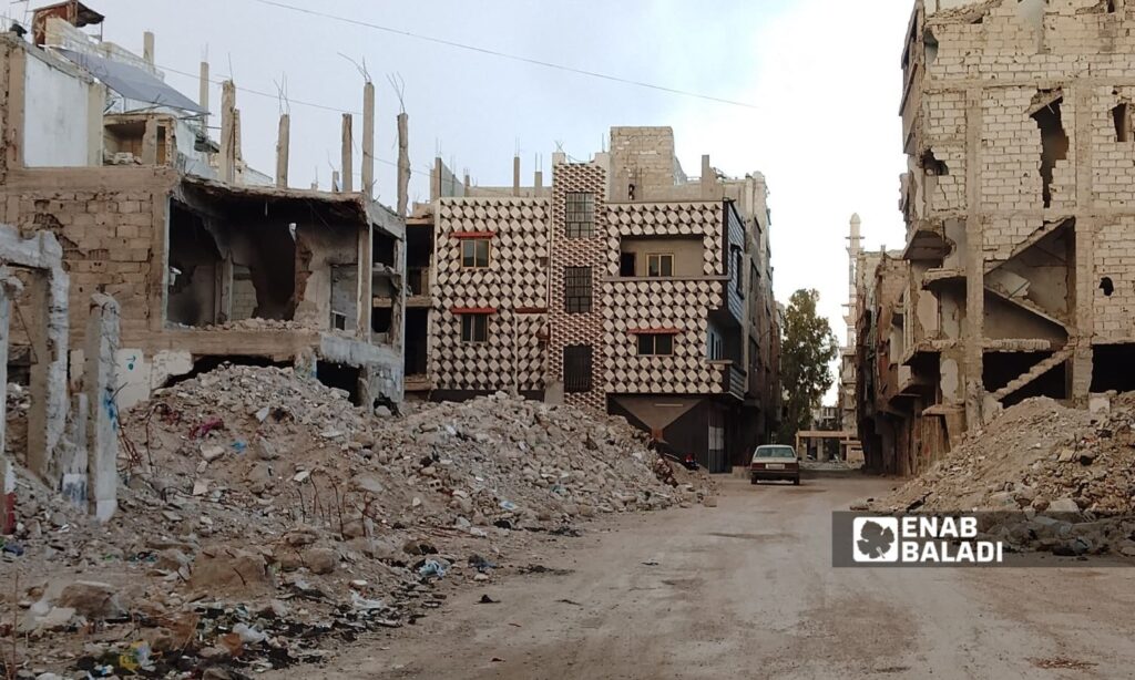 A recently renovated house amidst the destruction in the Yarmouk Camp in Damascus, February 10, 2025 (Enab Baladi/Omar Alaa Eldin)