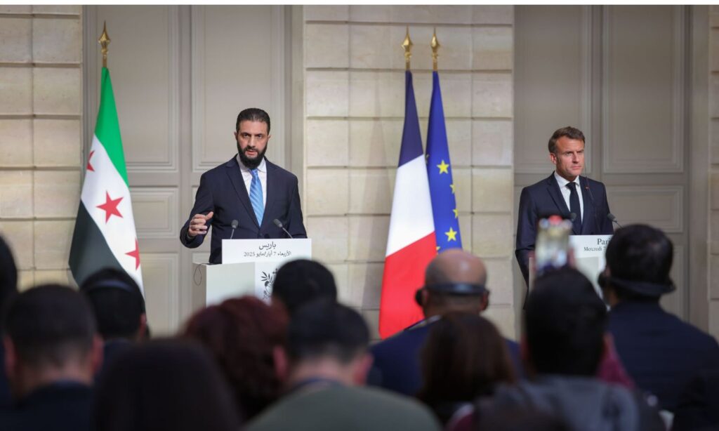 Syrian transitional president Ahmed al-Sharaa and his French counterpart Emmanuel Macron at a press conference in Paris - May 7, 2025 (Syrian Presidency)