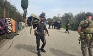 Elements from the Syrian Ministry of Interior during the process of seizing military equipment around Hmeimim Airport in Latakia, western Syria - March 18, 2025 (SANA)