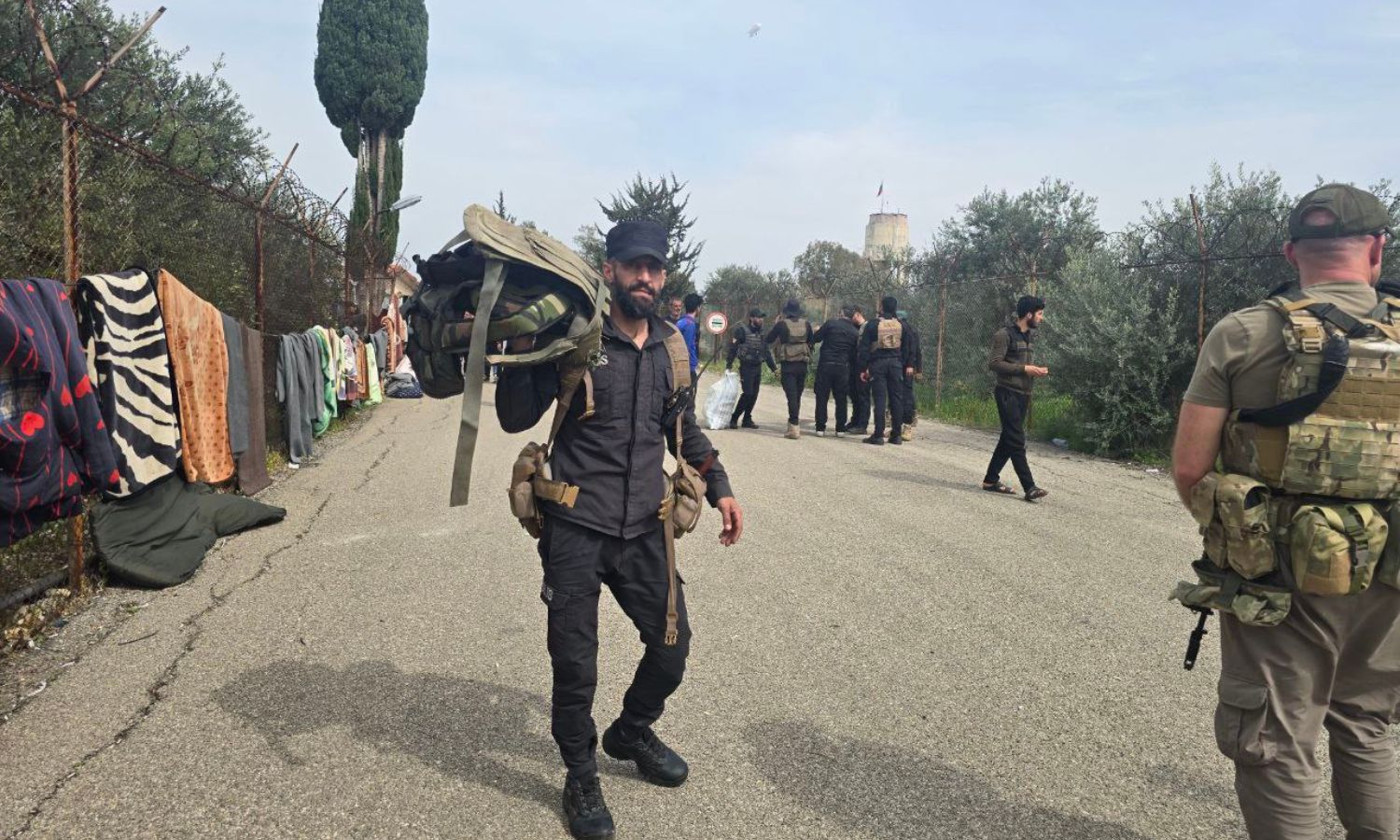 Elements from the Syrian Ministry of Interior during the process of seizing military equipment around Hmeimim Airport in Latakia, western Syria - March 18, 2025 (SANA)
