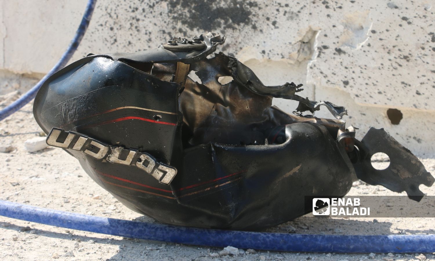 Remnants of a motorcycle targeted by a drone strike on the road to the town of al-Dana al-Bardakli in the northern Idlib countryside - June 10, 2025 (Enab Baladi/Mohamed Masto)