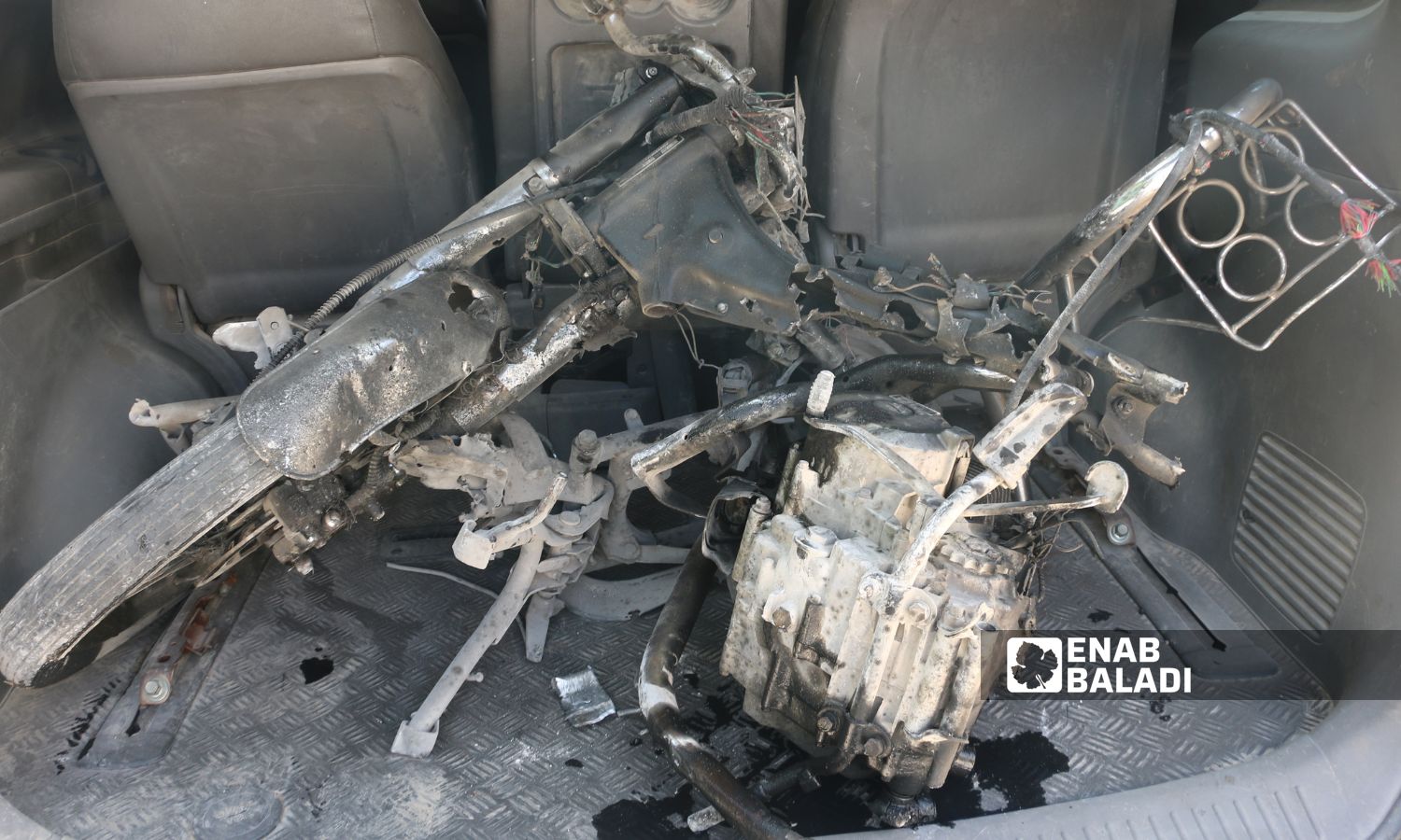 Remnants of a motorcycle targeted by a drone strike on the road to the town of al-Dana al-Bardakli in the northern Idlib countryside - June 10, 2025 (Enab Baladi/Mohamed Masto)