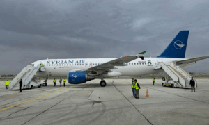 The first moments of the landing of a Syrian airplane and the reception of travelers at Aleppo International Airport on its opening date, March 19, 2025 (General Authority for Civil Aviation)