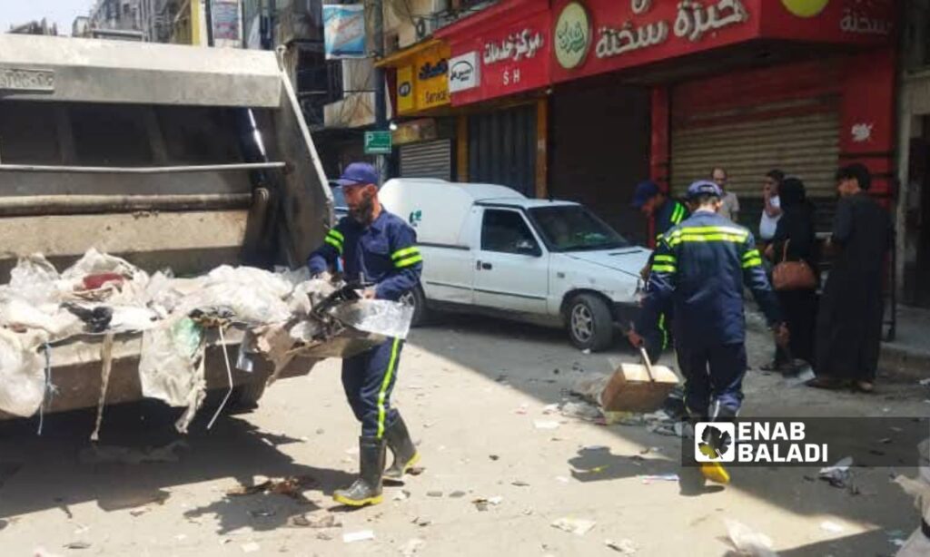 A cleaning campaign carried out by the Aleppo governorate in the al-Shaar neighborhood - June 7, 2025 (Enab Baladi/Mohammad Deeb Bazt)