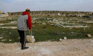 A Syrian farmer stands in front of his mine-contaminated farm after being injured by one in Aleppo, northern Syria - March 4, 2025 (AFP/Getty Images)