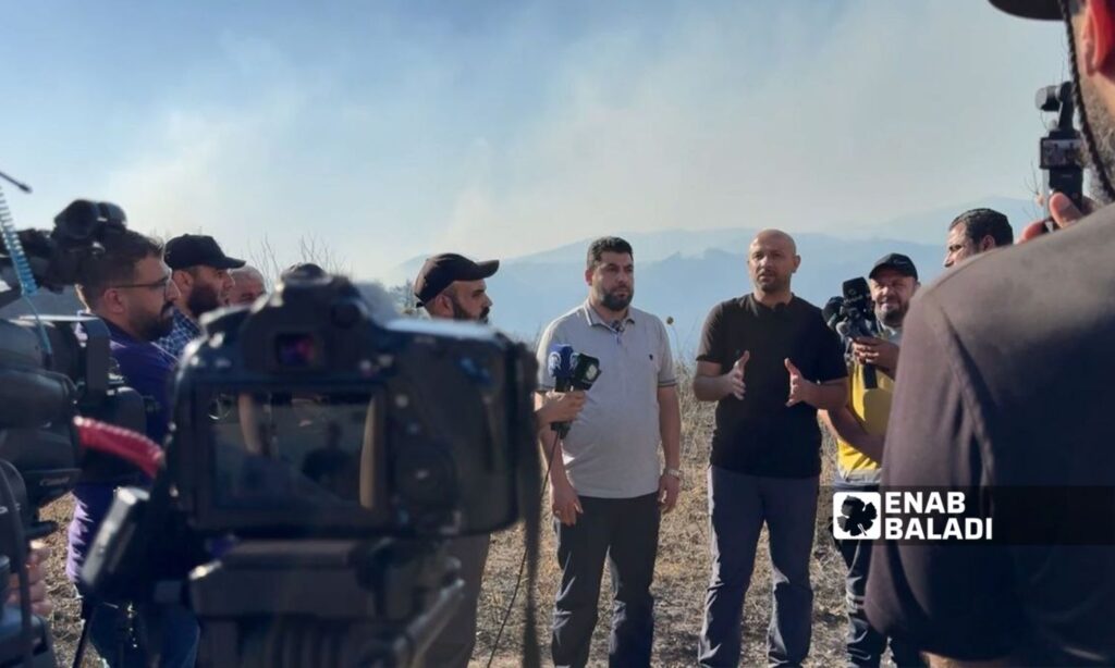 Minister of Emergency and Disasters Raed al-Saleh during a press conference at the Latakia wildfire site – July 8, 2025 (Enab Baladi/Diyan Janbaz)
