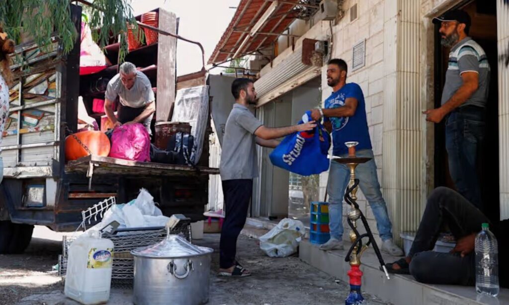 Residents of the al-Sumariyah neighborhood move their household furniture as they prepare to leave — August 30, 2025 (AP/Omar Sanadiki)