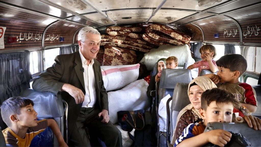 UN High Commissioner for Refugees Filippo Grandi aboard a bus carrying women and children returning from Lebanon to Syria at the Jdeidet Yabous border crossing (Rif Dimashq, southwestern Syria), June 20, 2025, UNHCR.