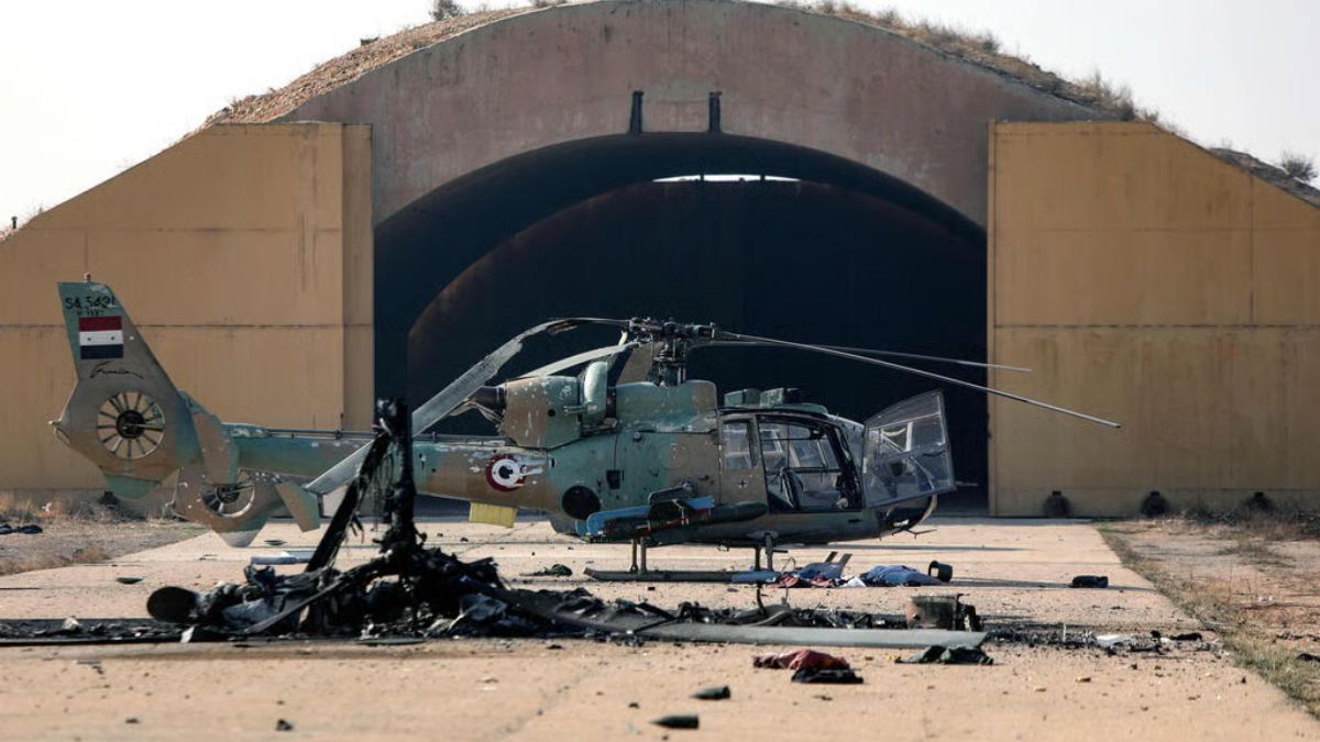A Syrian helicopter destroyed following an Israeli strike on Mezzeh Military Airport near Damascus, December 9, 2025, Agence France-Presse.