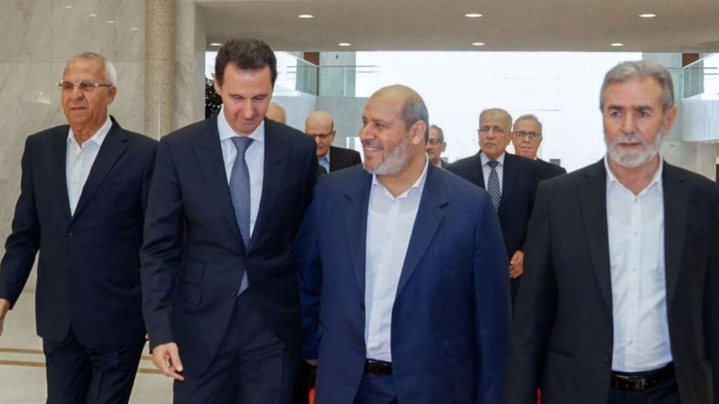 Ousted Assad with Hamas Political Bureau member Khalil a-Hayya, 19 October 2022 (Syrian Presidency / Facebook)