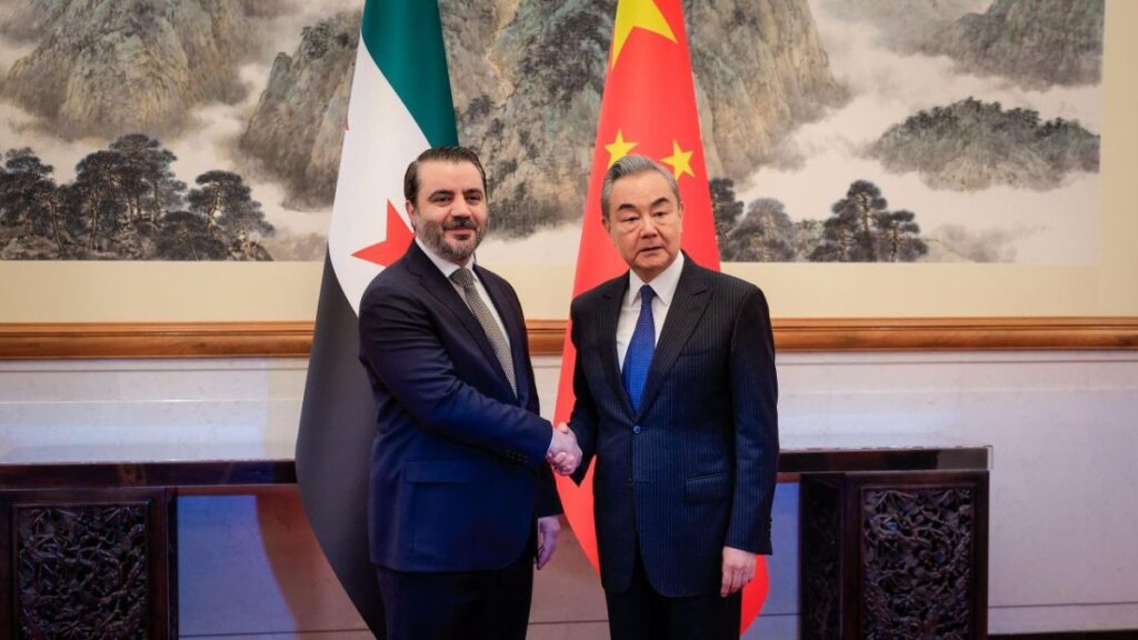 Syrian Foreign Minister Asad al-Shibani shakes hands with his Chinese counterpart Wang Yi in the Chinese capital Beijing, 17 November 2025 (Syrian Ministry of Foreign Affairs and Expatriates / X)