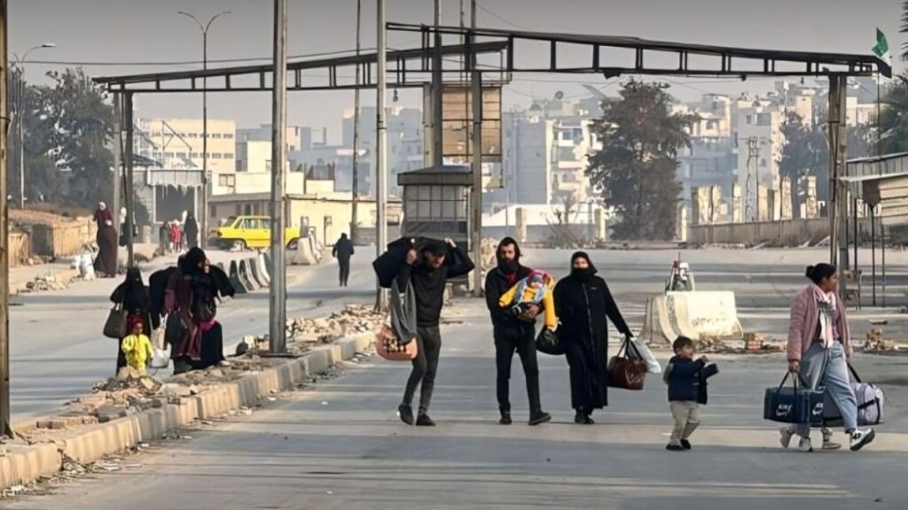Residents leaving the Sheikh Maqsoud neighborhood in Aleppo city (northern Syria), 23 December 2025 (Halab Today TV)