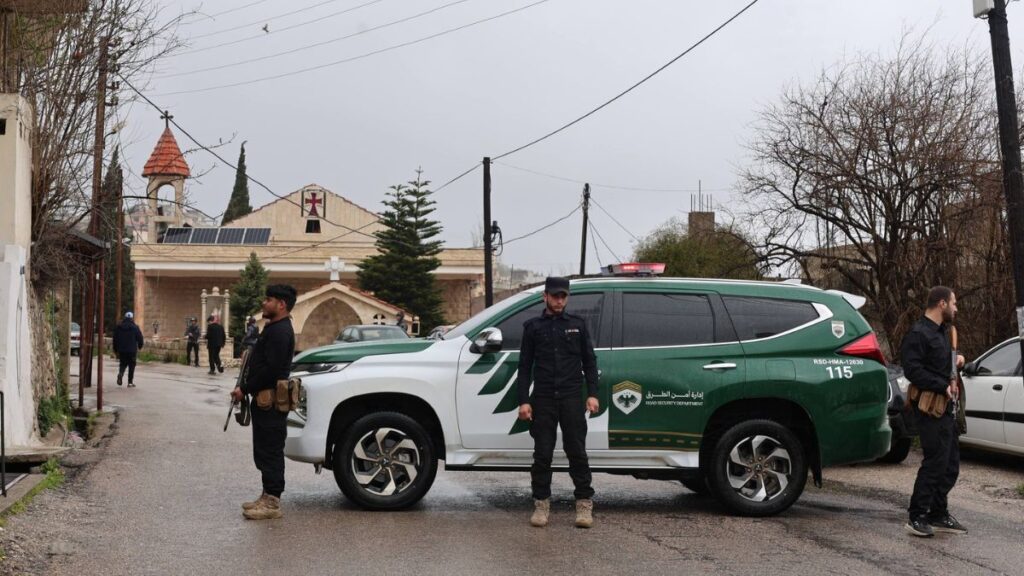 Internal Security personnel stand in front of a church during a religious service, March 29, 2026. (Syrian Interior Ministry)