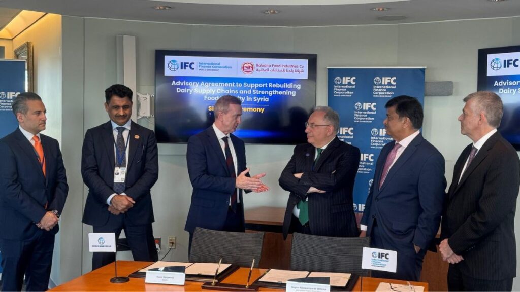 Syrian Finance Minister Mohammed Yisr Barnieh meets representatives of Qatar’s Baladna and the International Finance Corporation after signing a financing agreement in Washington, April 18, 2026. (Syrian Finance Minister/Facebook)