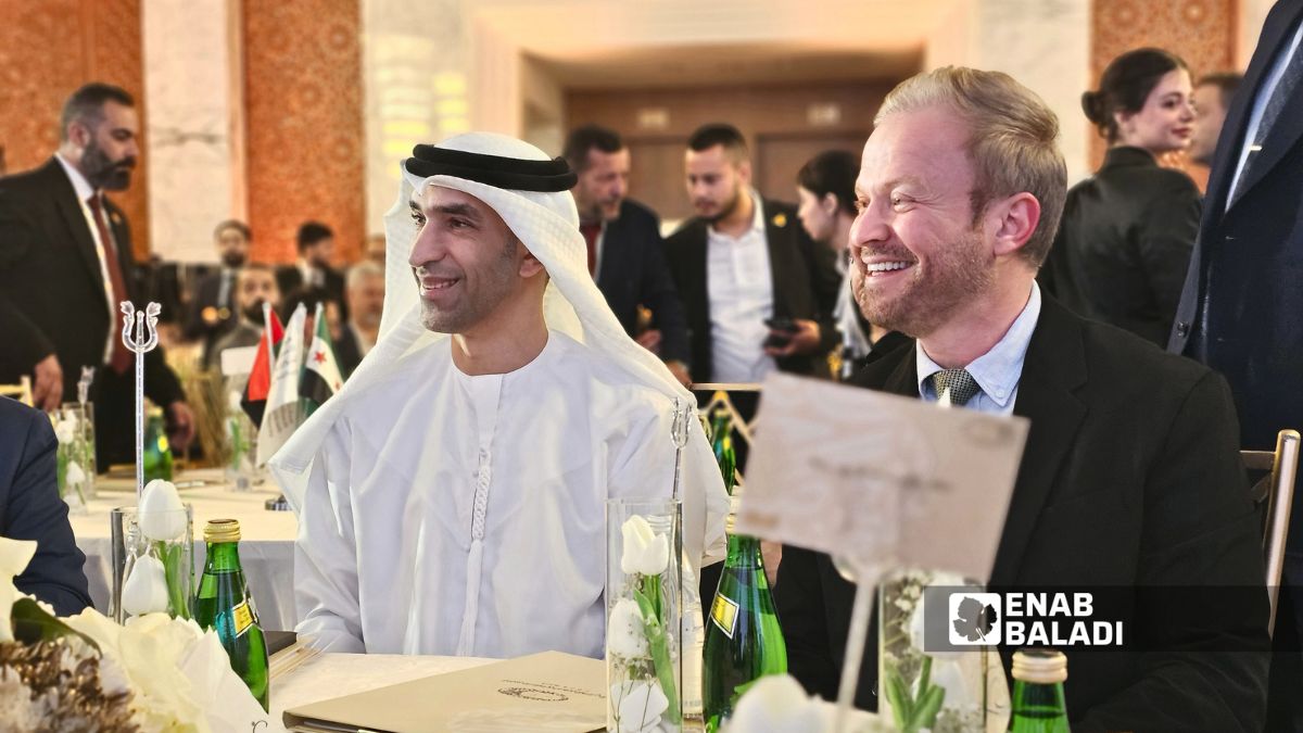 Head of the Syrian Investment Authority Talal Helali with UAE Minister of Foreign Trade Thani Al Zeyoudi during the opening of the first Syrian-Emirati Investment Forum in Damascus, May 11, 2026. (Enab Baladi/Ahmad Maslamani)