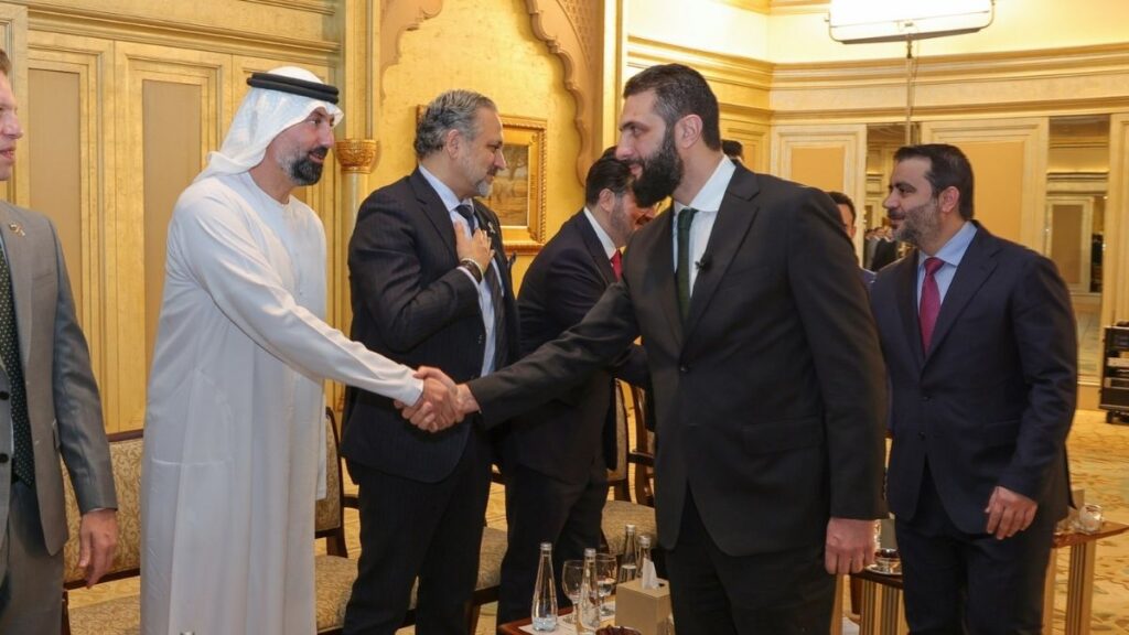 Syrian President Ahmed al-Sharaa and Foreign Affairs and Expatriates Minister Asaad al-Shaibani meet Syrian businessmen in the UAE, April 13, 2025. (Presidency of the Syrian Arab Republic)