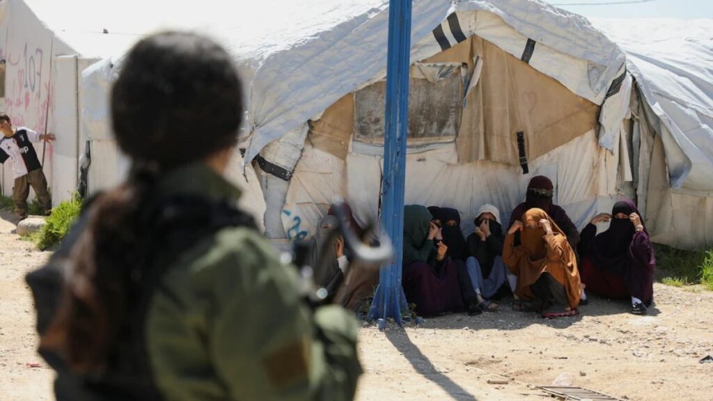 Members of Australian families wait to leave Roj camp in Syria, 22 May 2026. (Reuters)