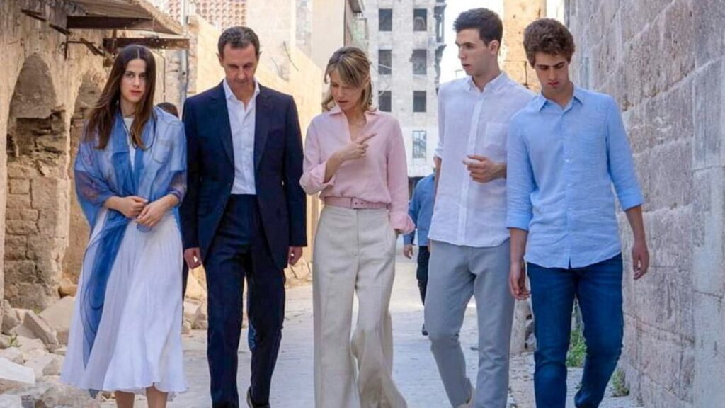 Bashar al-Assad with his wife, Asma, and their children walking in Aleppo, 2022 (former Syrian presidency Facebook page)