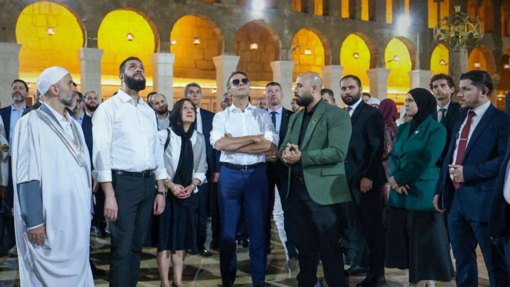 Syrian President Ahmed al-Sharaa accompanies French President Emmanuel Macron during a visit to the Umayyad Mosque in Damascus, July 6, 2026. (SANA)