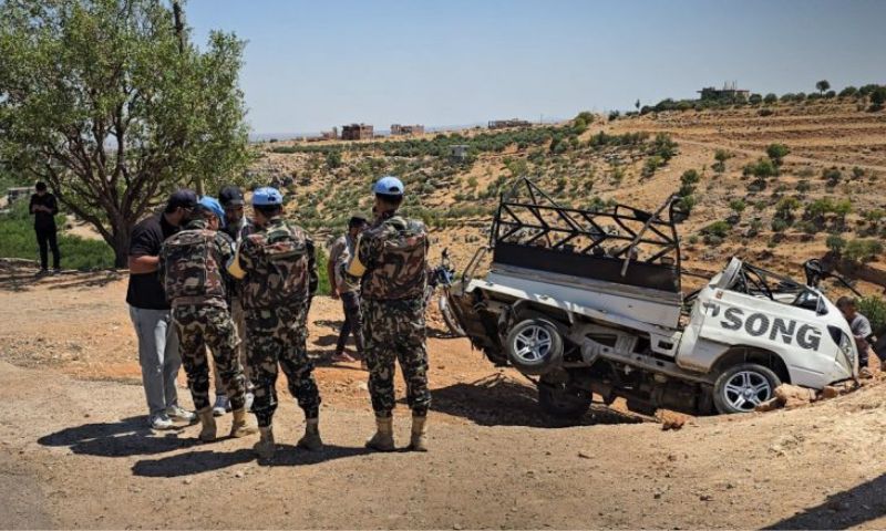 UNDOF forces inspect the site where a civilian car was targeted by an Israeli drone in Beit Jinn, August 22, 2026. (SANA)