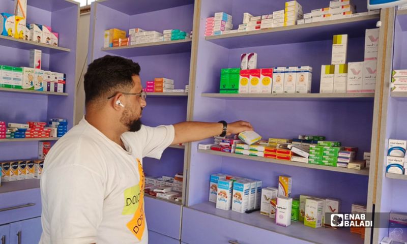 A pharmacist in the town of Tal Shihab, Daraa countryside (southern Syria), August 18, 2026. (Enab Baladi)