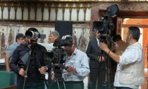 Photographers from state media cover the conference announcing the final third of the People's Assembly, July 1, 2026 (General Authority for Radio and Television).
