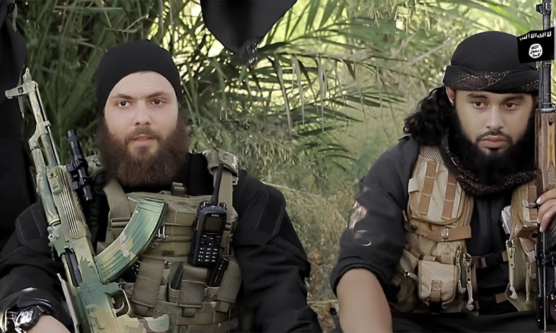Two Islamic State fighters in the Syrian city of Palmyra, August 2015 (AFP)