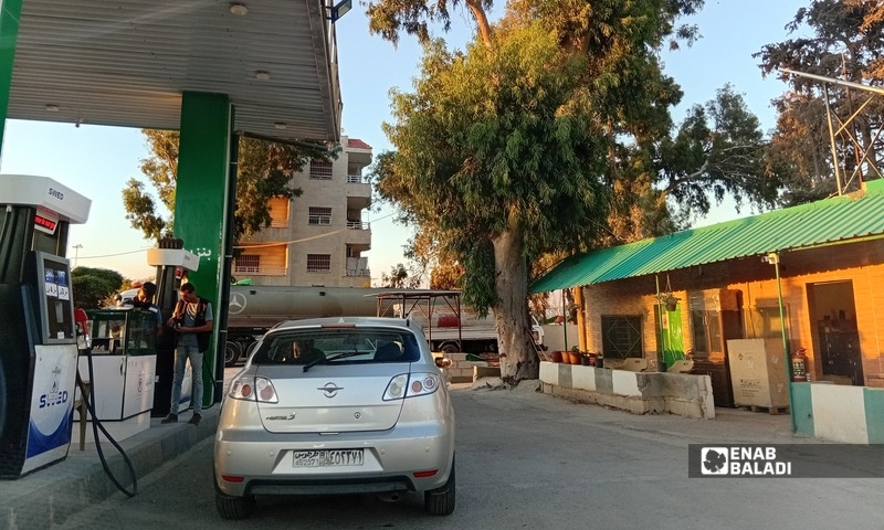 Residents fill their vehicles at a fuel station in Baniyas, Tartous governorate, western Syria, Sept. 9, 2026. (Enab Baladi)