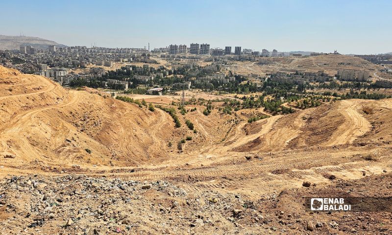Residents of Qudsaya suburb and other areas of Rural Damascus held a protest against the “Abyat Hills” project being built on expropriated land, September 26, 2026. (Enab Baladi/Ahmad Maslamani)