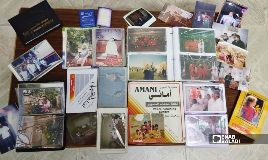 A collection of old family photo albums belonging to residents of Darayya, August 29, 2026. (Enab Baladi, Muhammad Mushmushtin)